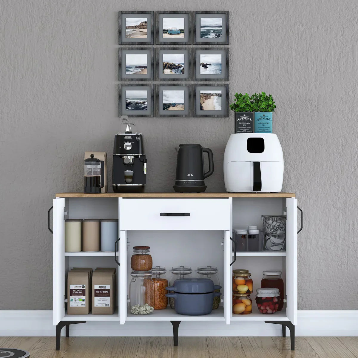 Kitchen island with appliances and decor against a gray wall