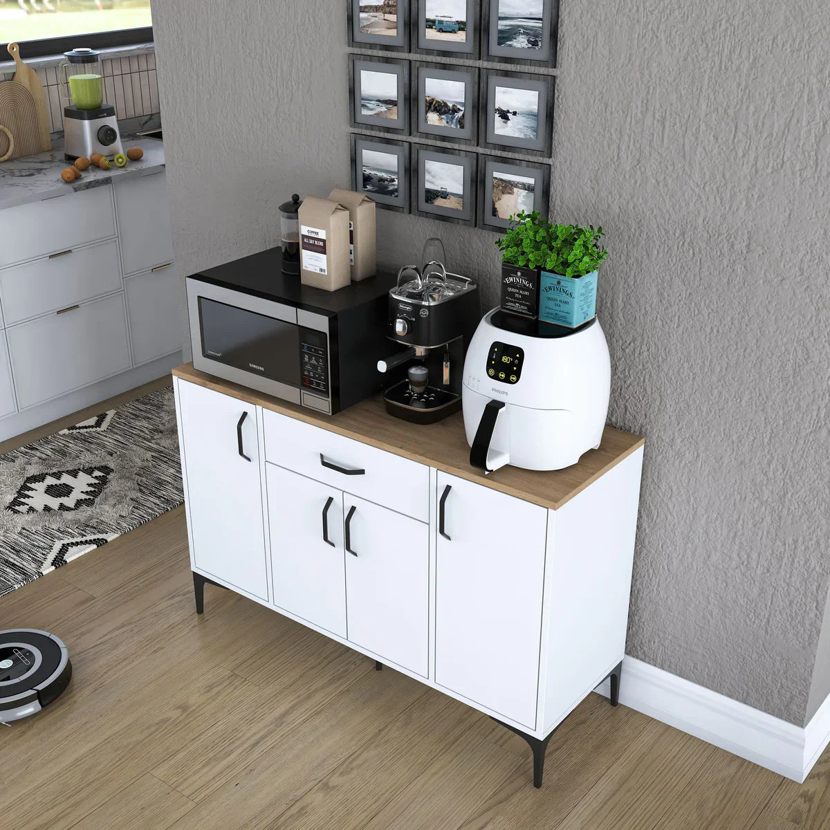 White kitchen cabinet with wooden top holding kitchen appliances and decor items in a room.
