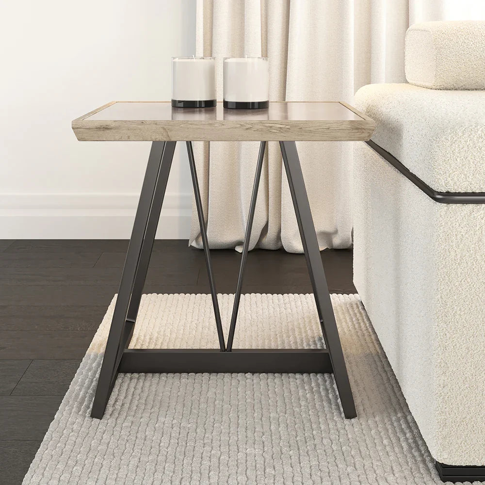 Small wooden side table with metal legs in a living room setting.