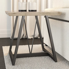 Small wooden table with metal legs in a room setting