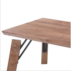 Wooden table with metal legs on a white background