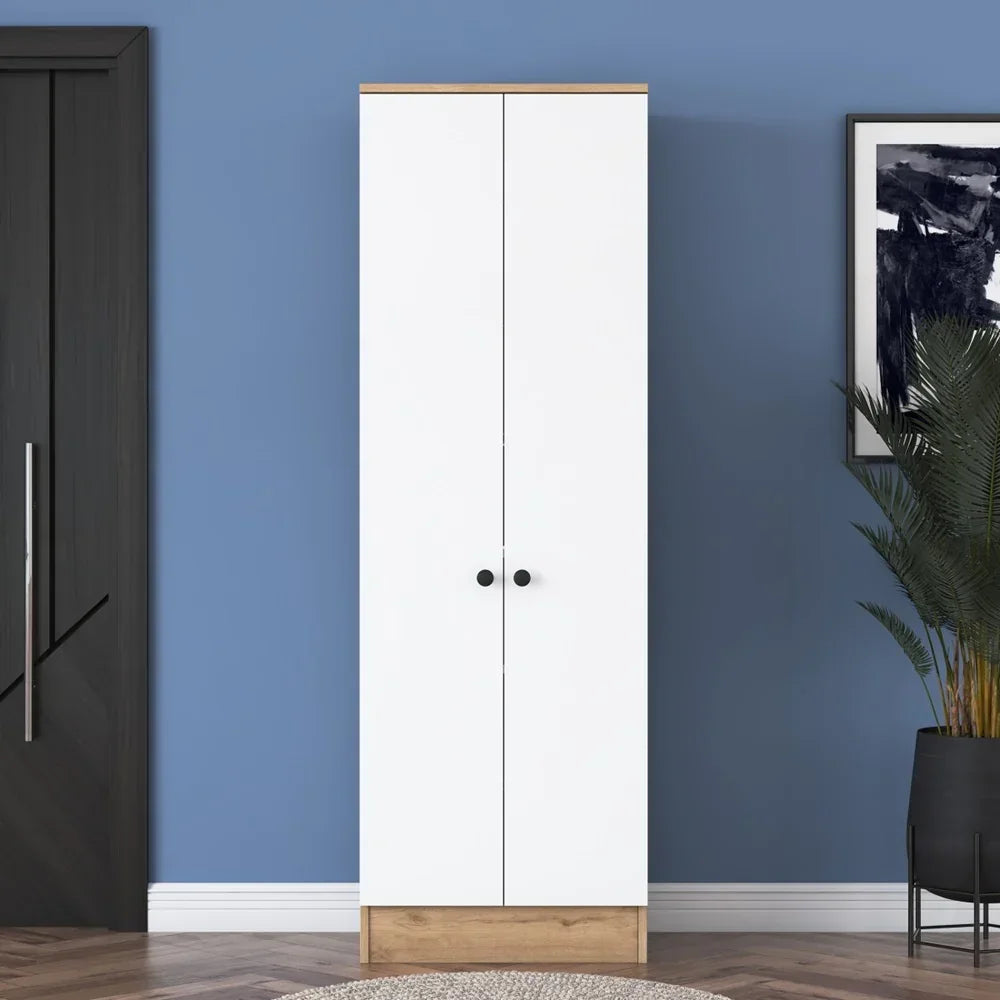 White wardrobe with wooden accents against a blue wall with a plant and framed picture.
