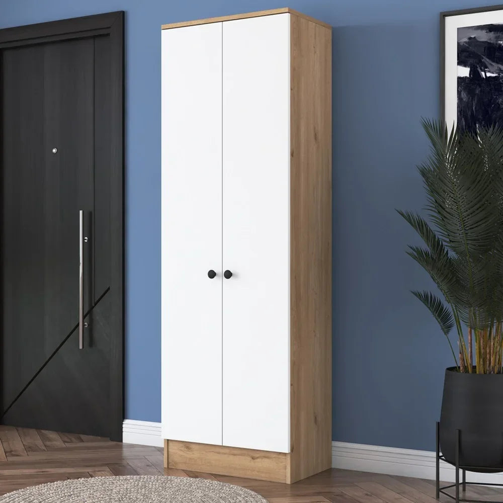 White and wood-colored wardrobe against a blue wall with a plant and black door in the background.