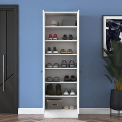 White shoe rack with shoes against a blue wall