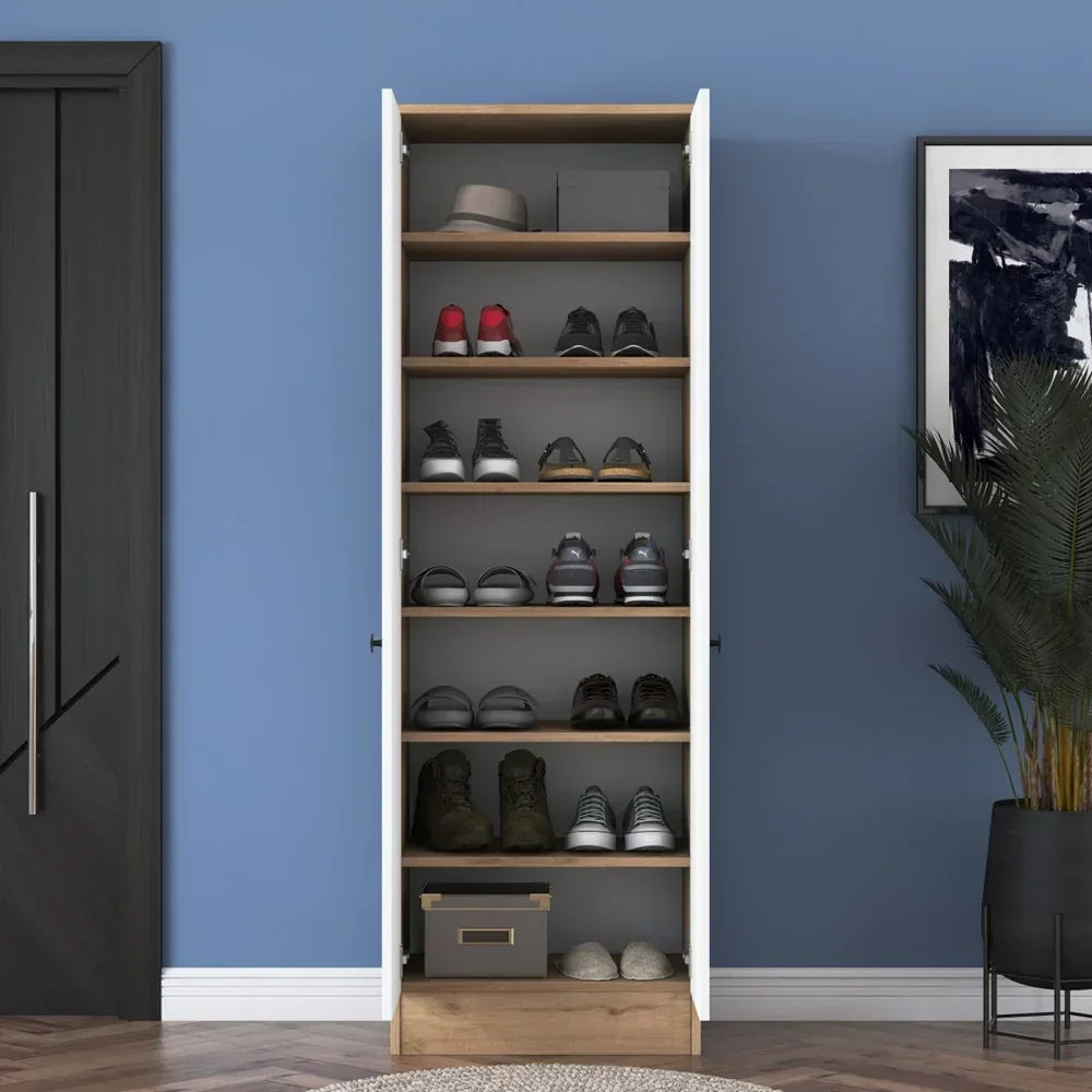Wooden shoe cabinet with shoes against a blue wall