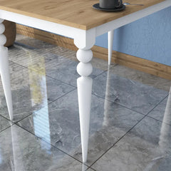Wooden table with white legs on a tiled floor