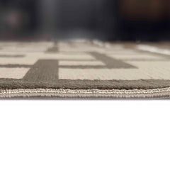 Close-up of a patterned rug with geometric design on a white background