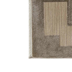 Close-up of a textured rug with geometric pattern on a white background