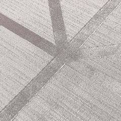 Close-up of a textured concrete surface with intersecting diagonal lines.