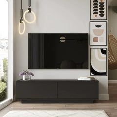 Modern living room with a black TV stand, flat-screen TV, and decorative wall art.