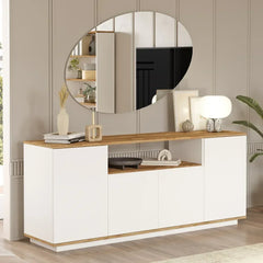Modern living room with a white sideboard, round mirror, and decorative items.