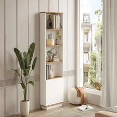 Tall white bookshelf with wooden accents in a room with a large window and plant.