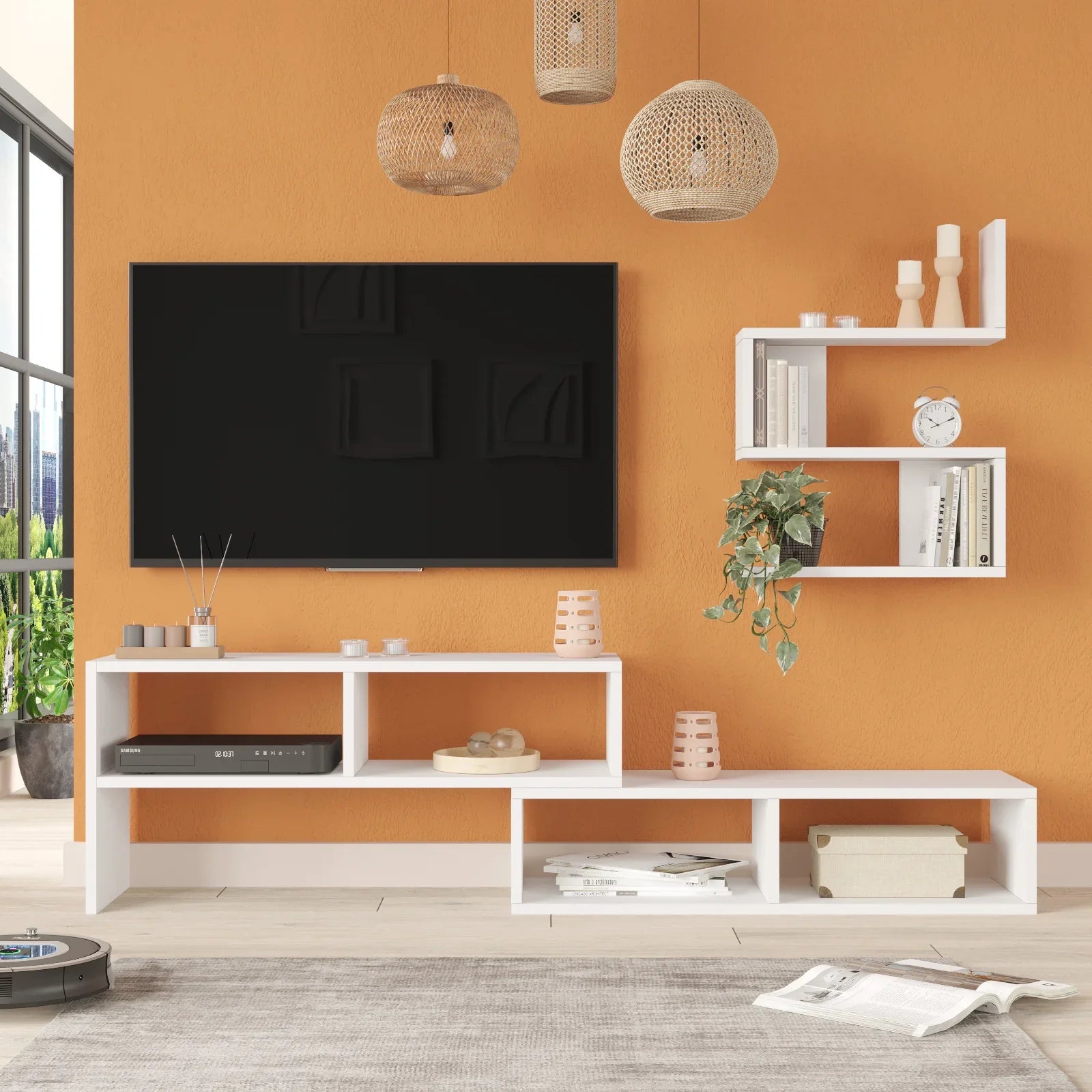 Modern living room with a white entertainment console, TV, and shelves against an orange wall.