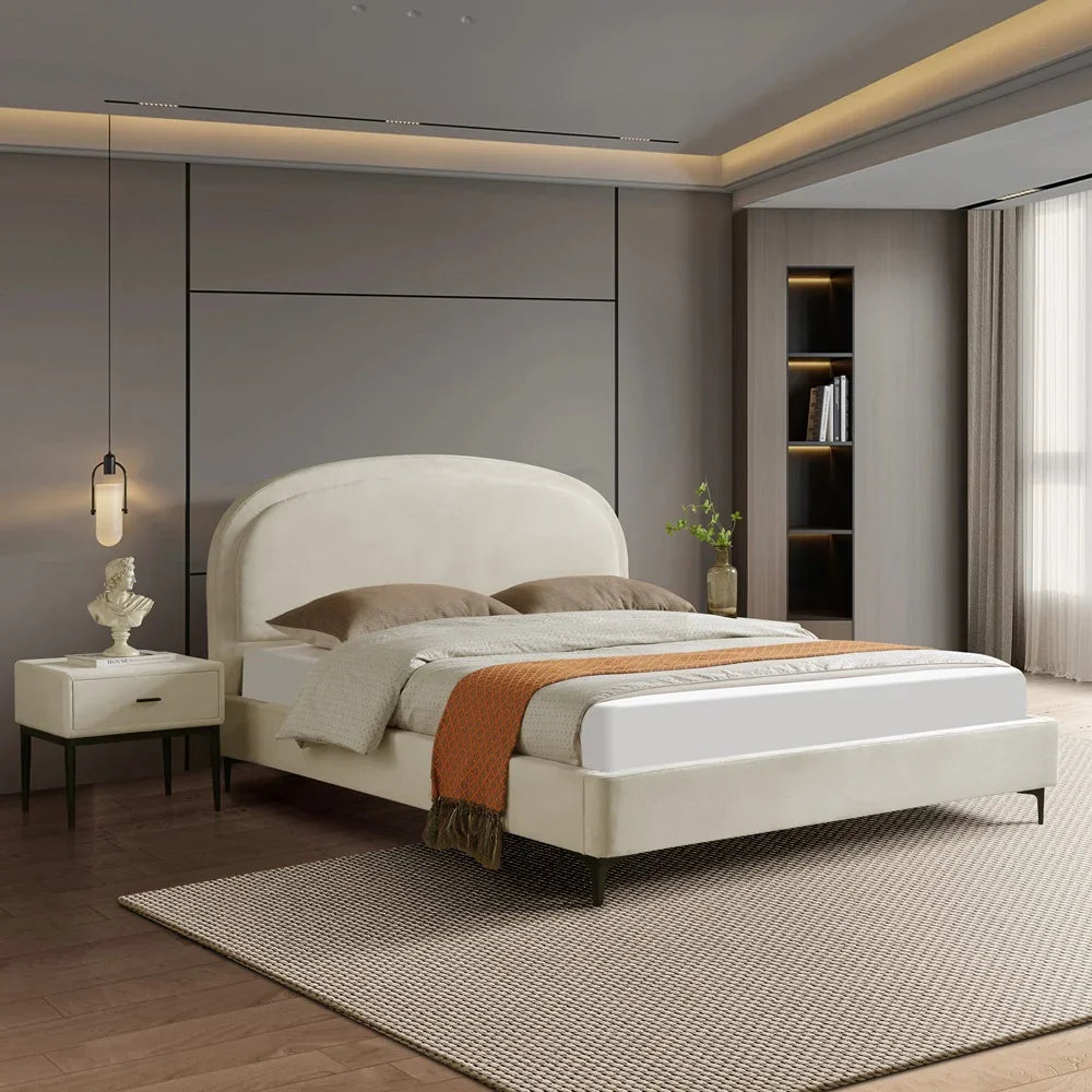 Modern bedroom with a white bed, nightstands, and decor.