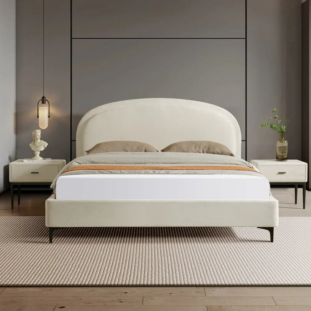 Modern bedroom with a white bed and matching nightstands against a gray wall.