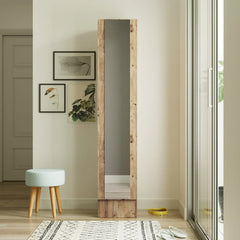 Full-length mirror with wooden frame in a room with a stool and decor items.