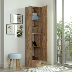 Wooden wardrobe with open doors in a room with a stool, rug, and plants.