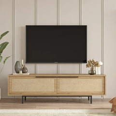 Wooden TV stand with a television mounted on a wall with decorative elements.