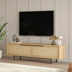 Wooden TV stand with a television mounted on a wall in a room with decor elements.