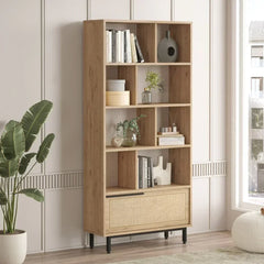Wooden bookshelf with decorative items in a room with a plant and window.
