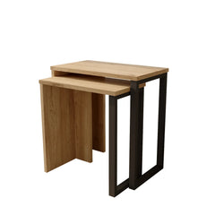 Set of two wooden nesting tables with black metal legs on a white background