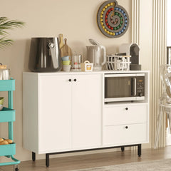 White kitchen cabinet with appliances and decor in a home setting