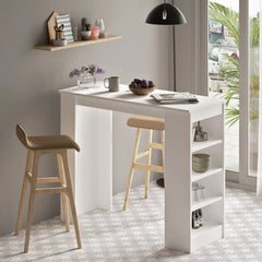 White kitchen island with bar stools in a modern kitchen setting