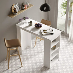 White dining table with chairs in a modern kitchen setting