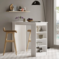 White kitchen island with wooden stools against a gray wall with shelves.