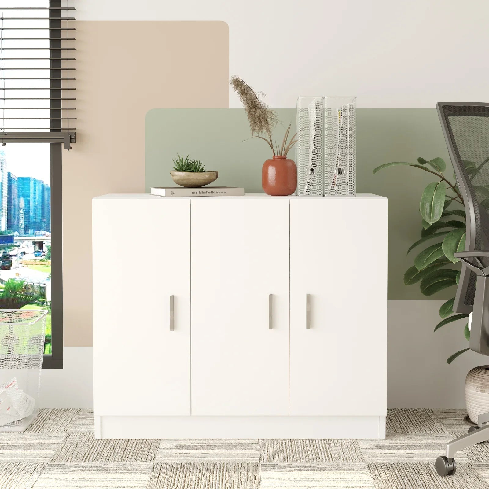 White storage cabinet in a room with a chair and decorative items.