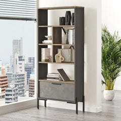 Modern office interior with a bookshelf, desk, and city view.