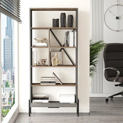 Modern bookshelf with decorative items in a room with a city view