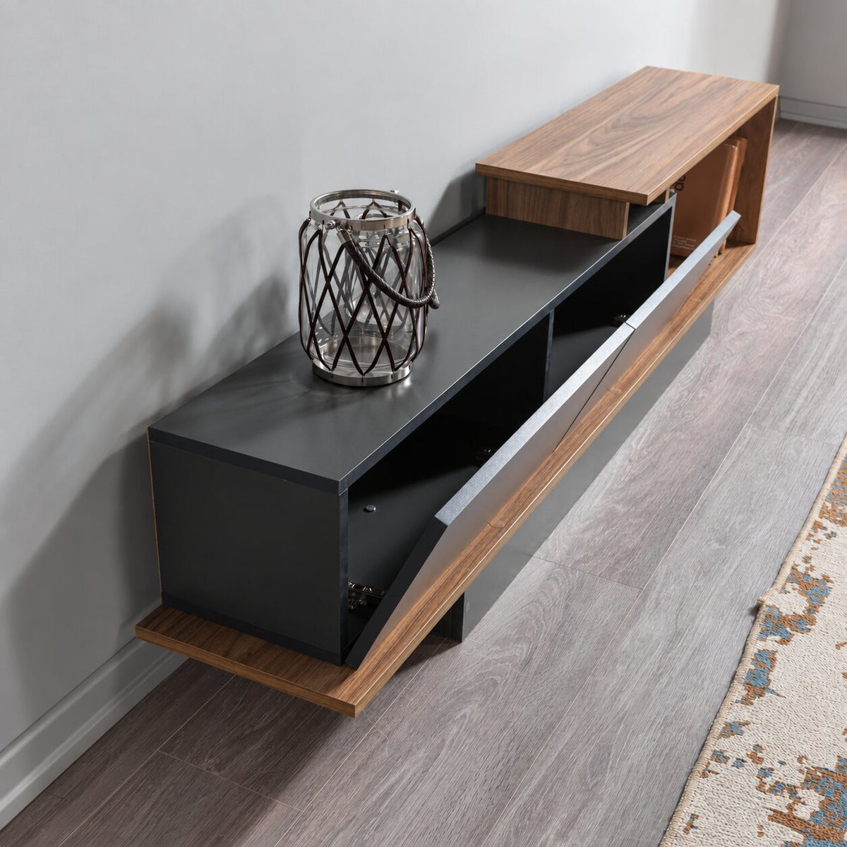 Angled view of the AshLine TV unit with its cabinet door open